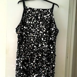 Light camera action with this fun flirty silvered paillet  sliver meshed dress